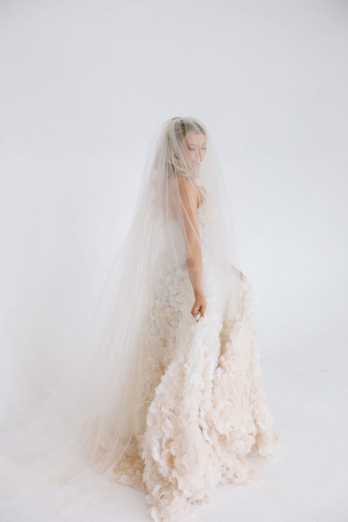 Modern glowing bridal makeup and textured half up curls styled by Hannah Bailey on a blonde model for a Glasgow wedding directory shoot.